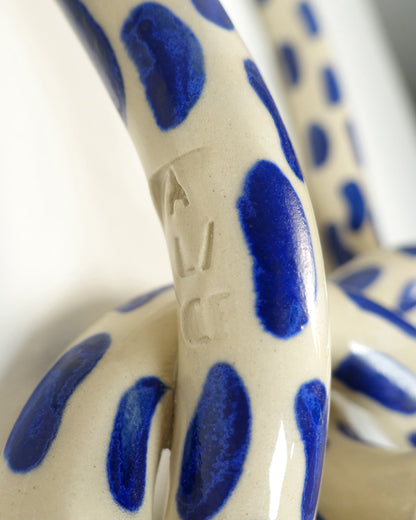 Wall knot with blue brush strokes