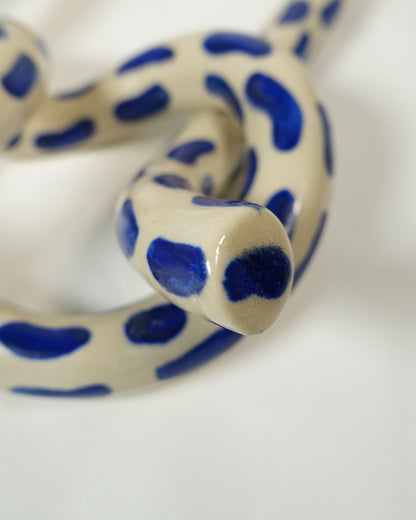 Wall knot with blue brush strokes